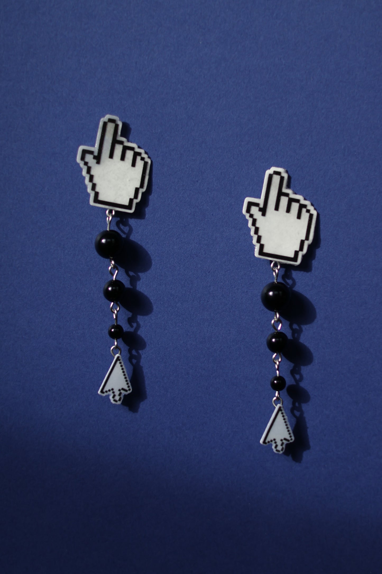 Clack! No.6 hand cursor stud earrings