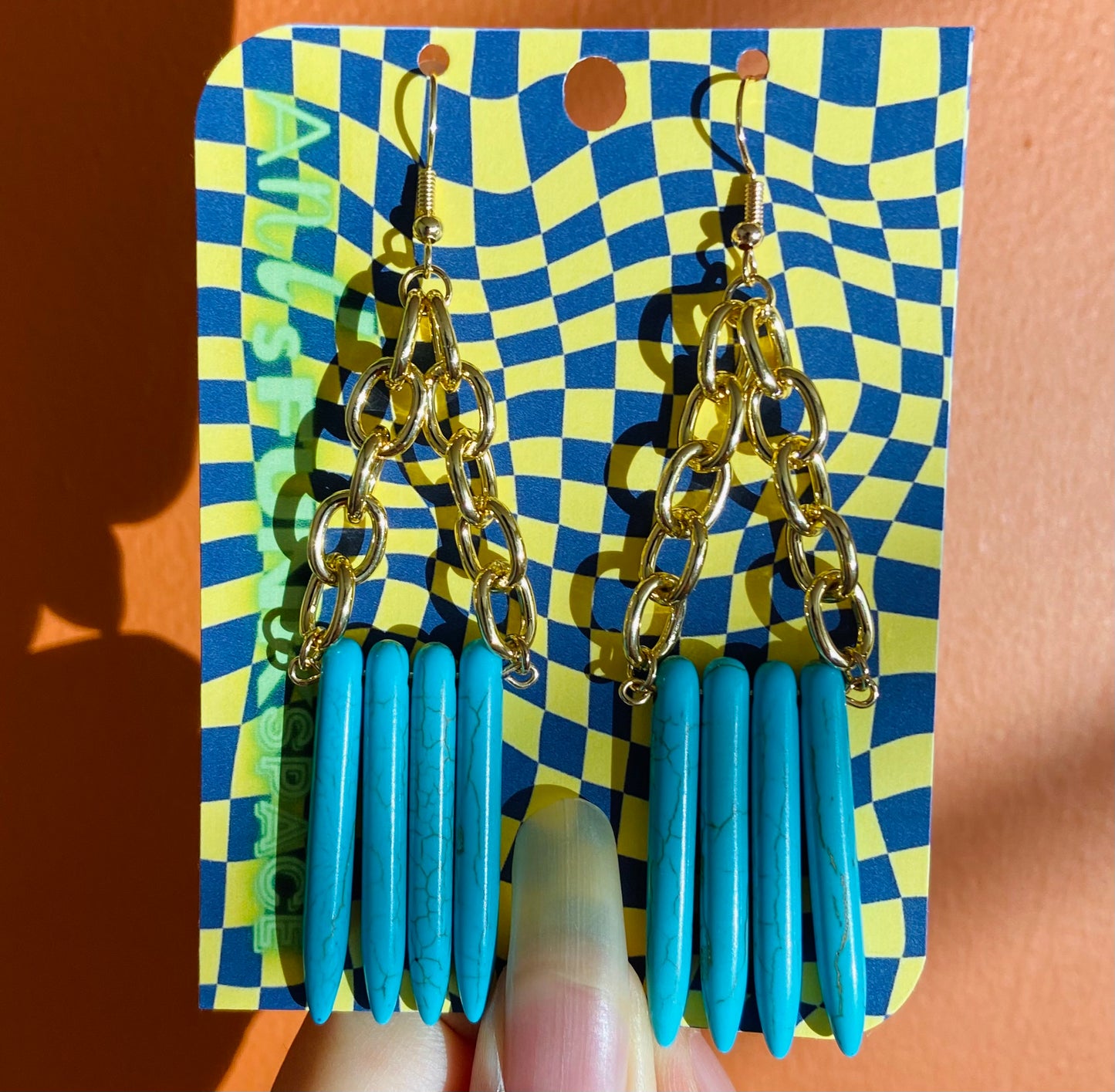 Reconstituted turquoise spike earrings